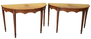 Pair Mahogany Demilune, with carved skirts, height 30 inches, width 47 1/2 inches, depth 23 inches.