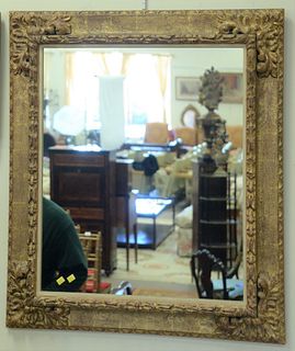 Pair of Contemporary Continental Style Giltwood Mirrors, having foliate carved corners, 38 3/4" x 33 3/4".
