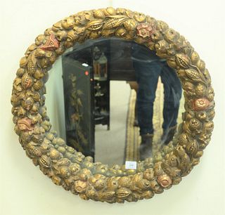 Round Gilt Mirror having vegetable and fruit carved frame, diameter 27 inches.