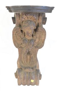 Putti carved shelf with wings set on scroll, height 25 inches, width 14 inches.