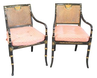 Set of Five Black Stenciled Armchairs, with caned backs and seats, back caning with imperfections, seat caning supported by wood, arms worn on three c