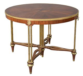 Continental Style Round Table, in the manner of Jansen, trimmed in brass, set on brass bamboo turned legs, with open stretchers, height 29 1/2 inches,
