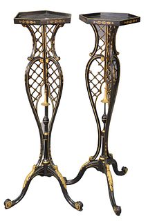 Pair of Victorian Black Lacquered and Gilt Decorated Fern Stands, having hexagon tops over pierced shaft, raised on tripod base, height 44 inches.