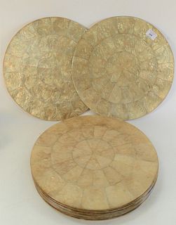 Fourteen Kim Seybert Round Capiz Shell Placemats, retails for $380 for a set of four, diameter 15 inches.