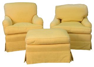 Two Easy Chairs, in custom yellow upholstery, one with loose back and seat cushions (sun faded), seat height 18 inches; along with one ottoman.