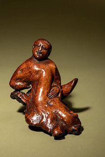 A Carved Root Figure of a Reclining Man and Stand