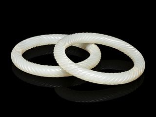 A Pair of White Jade 'Twisted Rope' Bangles