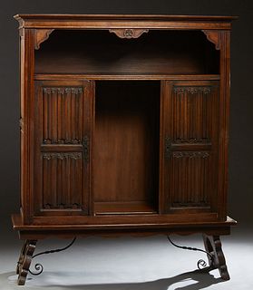 Spanish Renaissance Style Sideboard, early 20th c., the rounded edge stepped crown over open storage and double linenfold paneled doors with wrought i