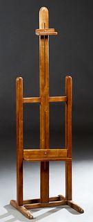 French Carved Beech Adjustable Artist's Easel, 19th c., on trestle supports, joined by square stretchers, H.- 68 in., W.- 20 in., D.- 20 in.