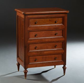 French Louis XVI Style Carved Cherry Commode, 20th c., the stepped rounded edge and corner top, over a bank of four drawers, flanked by reeded pilaste
