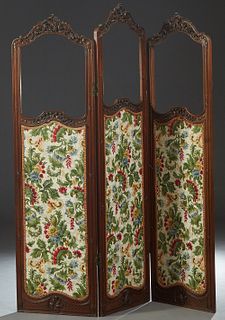 Louis XV Style Carved Walnut Three Panel Dressing Screen, late 19th c., each arched panel with a C-scroll and floral carved crest over a previously gl