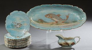 Fourteen Piece English Ceramic Fish Set, c. 1900, by Empire Works, Stoke On Trent, consisting of 12 relief decorated scalloped circular gold rim plate