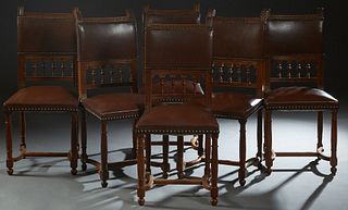 Set of Six French Henri II Style Carved Walnut Dining Chairs, late 19th c., the canted brown leather upholstered back over a spindled gallery, to a tr