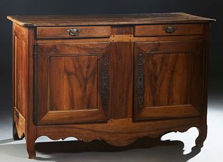 French Provincial Carved Walnut Louis XV Style Sideboard, 19th c., the ogee edge rounded corner top over two frieze drawers and double cupboard doors 