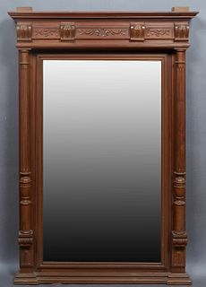 French Henri II Style Carved Walnut Overmantel Mirror, c. 1880, the stepped crown over a setback wide beveled rectangular plate flanked by two turned 
