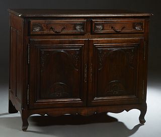 French Provincial Louis XV Style Carved Cherry Sideboard, 19th c., the stepped rounded corner and edge top over two frieze drawers and double fielded 