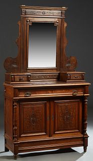 French Henri II Style Carved Walnut Marble Top Dresser, 19th c., the stepped crown above an arched wide beveled rectangular mirror above two candle st