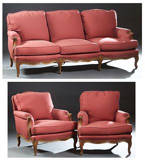 French Louis XV Style Carved Beech Three Piece Parlor Suite, 20th c., consisting of two bergeres and a triple sofa, the sofa with a serpentine back an