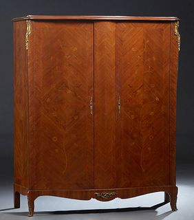 French Louis XV Style Ormolu Mounted Inlaid Mahogany Armoire, 20th c., the serpentine crown over two marquetry inlaid bombe doors, flanked by parquetr