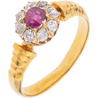 RING WITH RUBY AND DIAMONDS IN 18K YELLOW GOLD 1 Oval cut ruby ~0.20 ct, 8 Antique cut diamonds ~0.40 ct. Size: 6 ¼