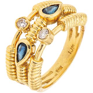 RING WITH SAPPHIRES AND DIAMONDS IN 18K YELLOW GOLD 2 Pear cut sapphires ~0.60 ct, 2 Brilliant cut diamonds Size: 6 ¾
