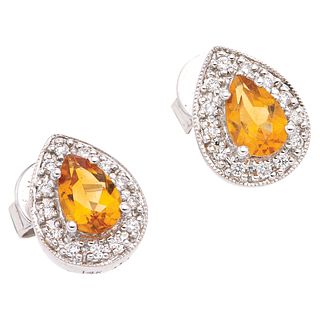 PAIR OF STUD EARRINGS WITH CITRINES AND DIAMONDS IN 14K WHITE GOLD 2 Pear cut citrines ~0.80ct, 26 Brilliant cut diamonds ~0.08ct