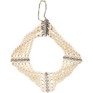 BRACELET OF CULTIVATED PEARLS AND DIAMONDS IN 10K WHITE GOLD 6 Strands of cream colored pearls, 48 8x8 cut diamonds