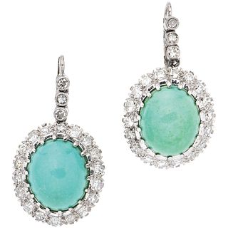 PAIR OF EARRINGS WITH TURQUOISES AND DIAMONDS IN 12K WHITE GOLD 2 Cabochon cut turquoise ~0.60 ct, 42 8x8 cut diamonds ~1.26 ct