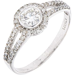 RING WITH DIAMONDS IN 14K WHITE GOLD 1 Brilliant cut diamond ~0.40 ct Clarity: SI2, 51 8x8 cut diamonds. Size: 8½