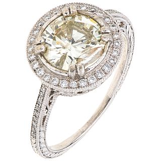 RING WITH DIAMONDS IN 18K WHITE GOLD 1 Brilliant cut diamond ~1.90 ct, 46 Brilliant cut diamonds ~0.30 ct. Size: 7¾