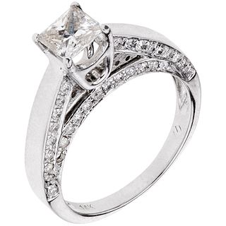 RING WITH DIAMONDS IN 14K WHITE GOLD 1 Princess cut diamond ~0.75 ct, 60 Brilliant cut diamonds ~0.60 ct. Size: 7