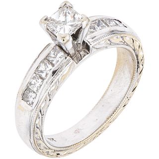 RING WITH DIAMONDS IN 18K WHITE GOLD 1 Princess cut diamond ~0.40ct Clarity:SI1-SI2, 8 Princess cut diamonds ~0.48ct