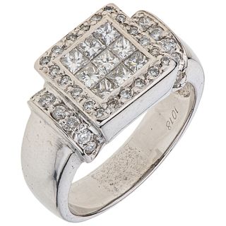 RING WITH DIAMONDS IN 14K WHITE GOLD 9 Princess cut diamonds ~0.90 ct, 34 Brilliant cut diamonds ~0.34 ct. Size: 7¾