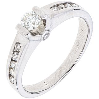 RING WITH DIAMONDS IN 14K WHITE GOLD 13 Brilliant cut diamonds ~0.40 ct. Weight: 3.2 g. Size: 5
