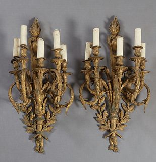 Pair of Large Impressive Louis XVI Style Gilt Bronze Five Light Wall Sconces, early 20th c., the flaming torch back plate issuing five curved leaf rel