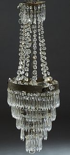 Brass and Crystal Wedding Cake Six Light Chandelier, early 20th c., the five relief concentric collapsible rings hung with button and spear prisms, an