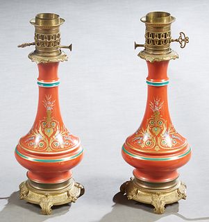 Pair of Victorian Bronze and Porcelain Banquet Lamps, 19th c., of tapered baluster form, with gilt and enameled decoration on an orange ground, on ste
