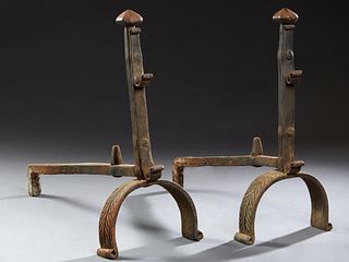 Pair of French Cast Iron Andirons, 19th c., with rounded octagonal ball tops, over tool holders, on curved relief decorated bases, H.- 22 1/2 in., W.-