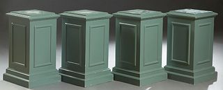 Set of Four Polychromed Carved Birch Pedestals, 20th c., the stepped square top over paneled sides, to a stepped square base, now in muted green paint