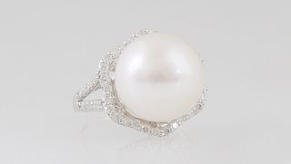 Lady's 14K White Gold Dinner Ring, with a 13mm round white cultured South Seas pearl, atop an octagonal border of tiny round diamonds, the split shoul