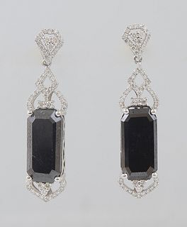 Pair of Platinum Pendant Earrings, with diamond mounted studs to rectangular 7.26 ct. black diamonds, the tops and bottoms of the black diamond with p