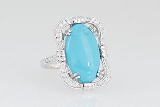 Lady's 14K White Gold Dinner Ring, with a 5.6 ct. oval cabochon turquoise centering a curved serpentine border of round diamonds, the shoulders of the