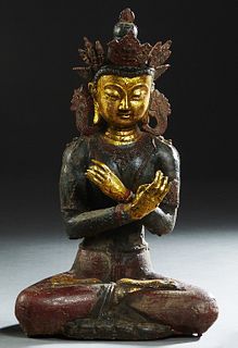 Tibetan Polychromed Iron Seated Vajradhara Figure, 18th c., on a lotus base, with a certificate of Authenticity, H.- 21 in., W.- 13 in., D.- 9 in.