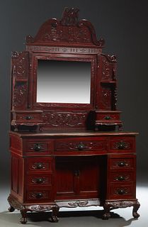 Chinese Republic Era Carved Mahogany Dresser, early 20th c., with a pierced bird crest over an arched crown with relief bird and dragon decoration, ab