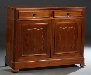 French Provincial Louis Philippe Carved Walnut Sideboard, 19th c., the rounded edge canted corner top over two frieze drawers, and double fielded pane