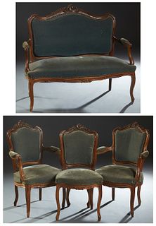 French Louis XV Style Carved Walnut Five Piece Parlor Suite, early 20th c., consisting of a loveseat, two fauteuils and a side chair. each arched cres