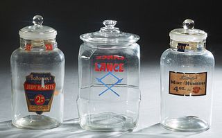Three Glass Countertop Advertising Jars, 20th c., one for "Bottomley's Mint Humbugs"; one for Lance products; and one for "Bottomley's Judy Barrets," 