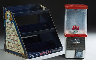 Two Countertop Advertising Items, early 20th c., consisting of a Komet 5c. gumball dispenser; and a tole display for Tru-Lax medicines, Tole- H.- 14 1