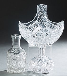 Group of Three Pieces of Cut Crystal, 20th c., consisting of two carafes, and a large handled basket, Basket- H.- 11 in., W.- 11 3/4 in., D.- 8 in. (3