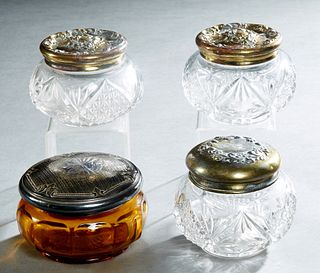 Group of Four Metal and Crystal Dresser Jars, early 20th c., two with repousse figural and floral decorated tops, one with repousse floral decorated t